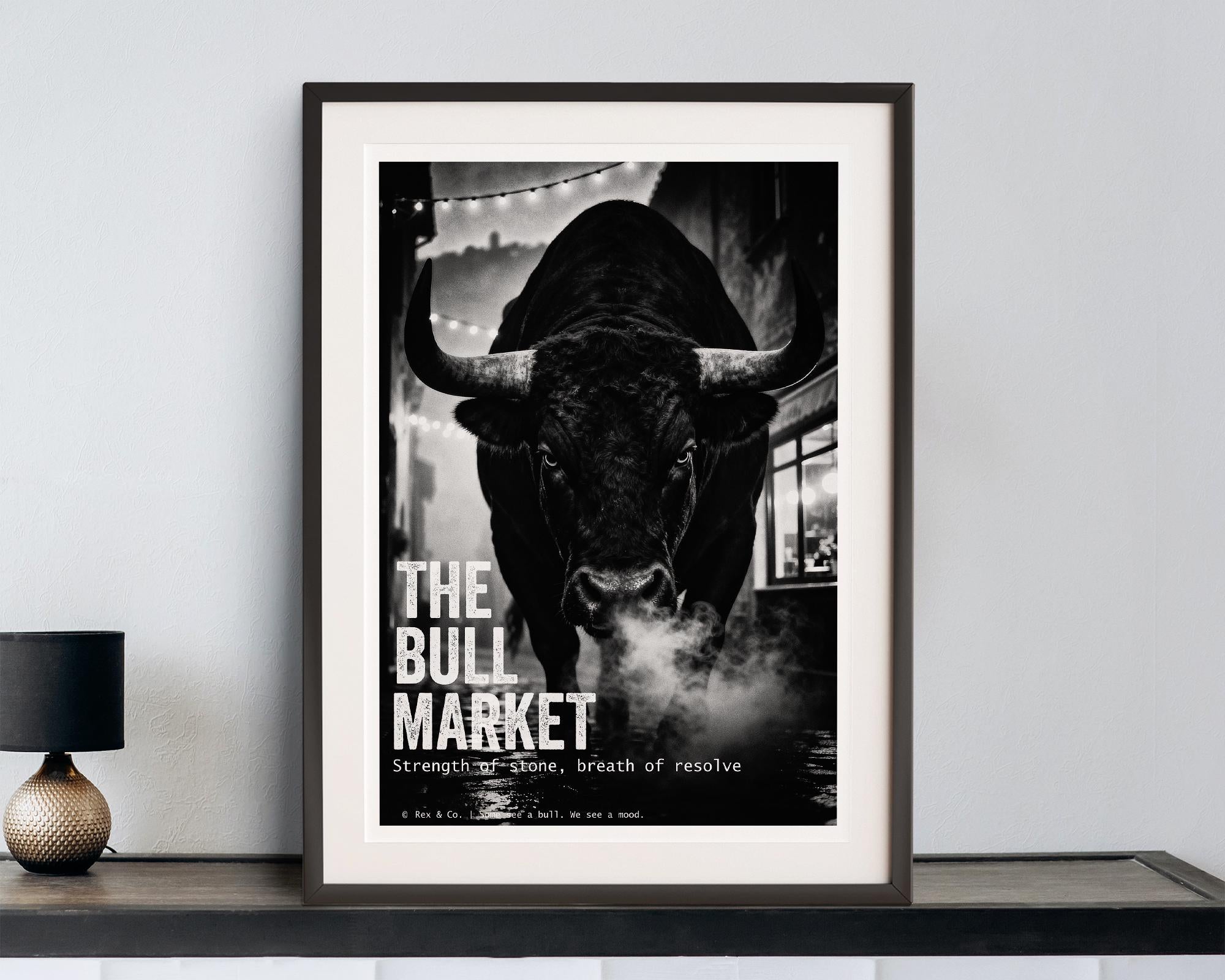 Framed poster of a bull with 'The Bull Market' text on a wall.