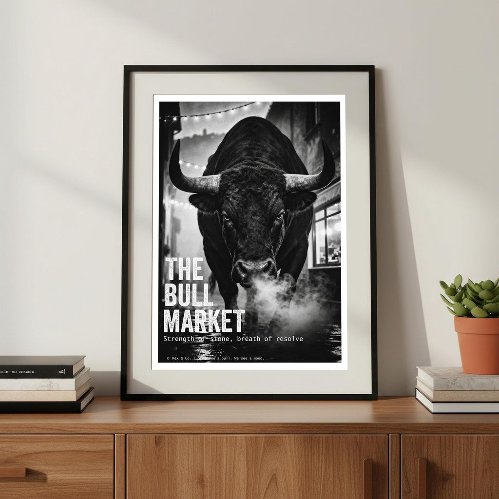 Framed poster of a bull with 'The Bull Market' text on a wooden shelf.