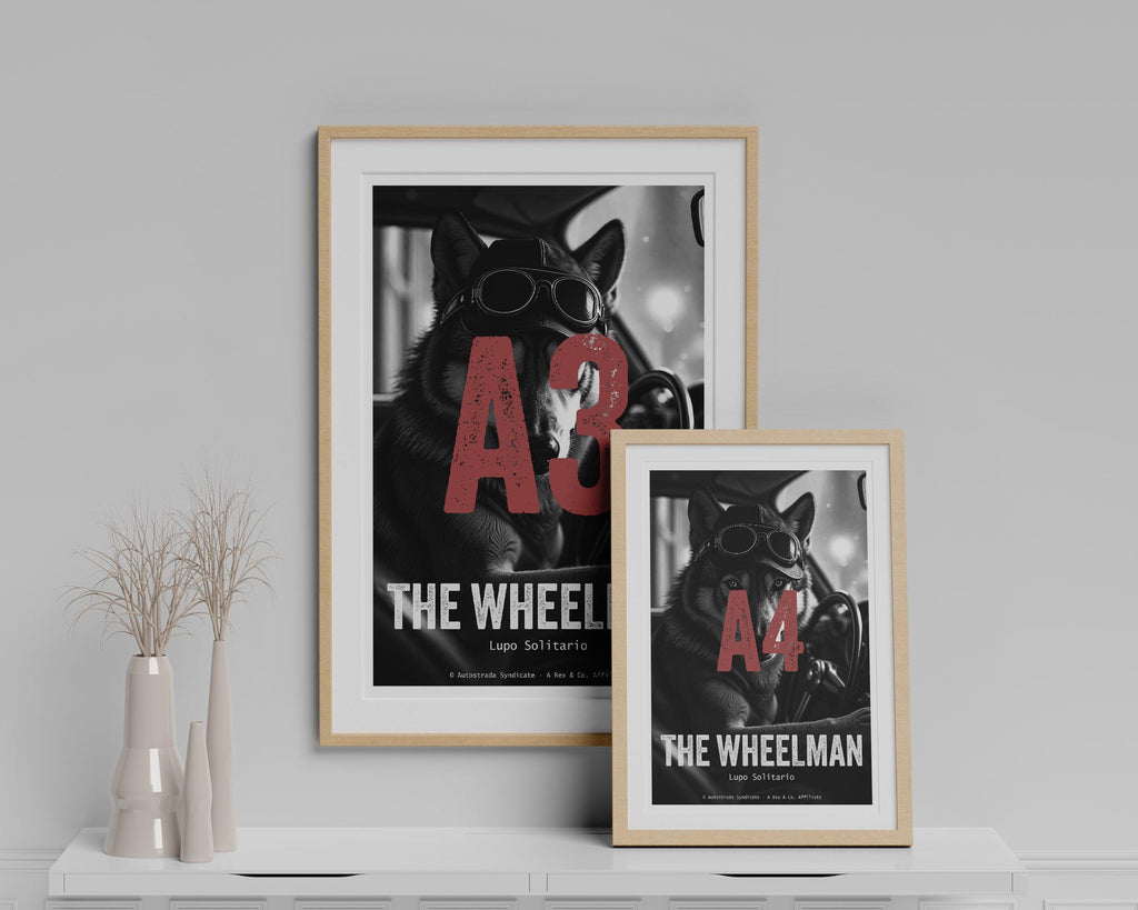 Two framed posters of 'The Wheelman' on a shelf with decorative vases.