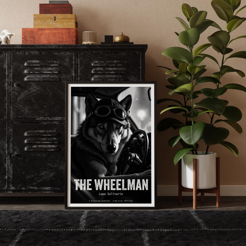 Framed poster of a wolf wearing goggles with 'The Wheelman' text, placed on a shelf with decorative items and a plant.