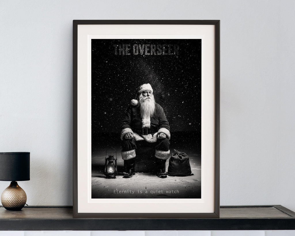 Framed black and white poster Santa 'The Overseer' on a shelf.