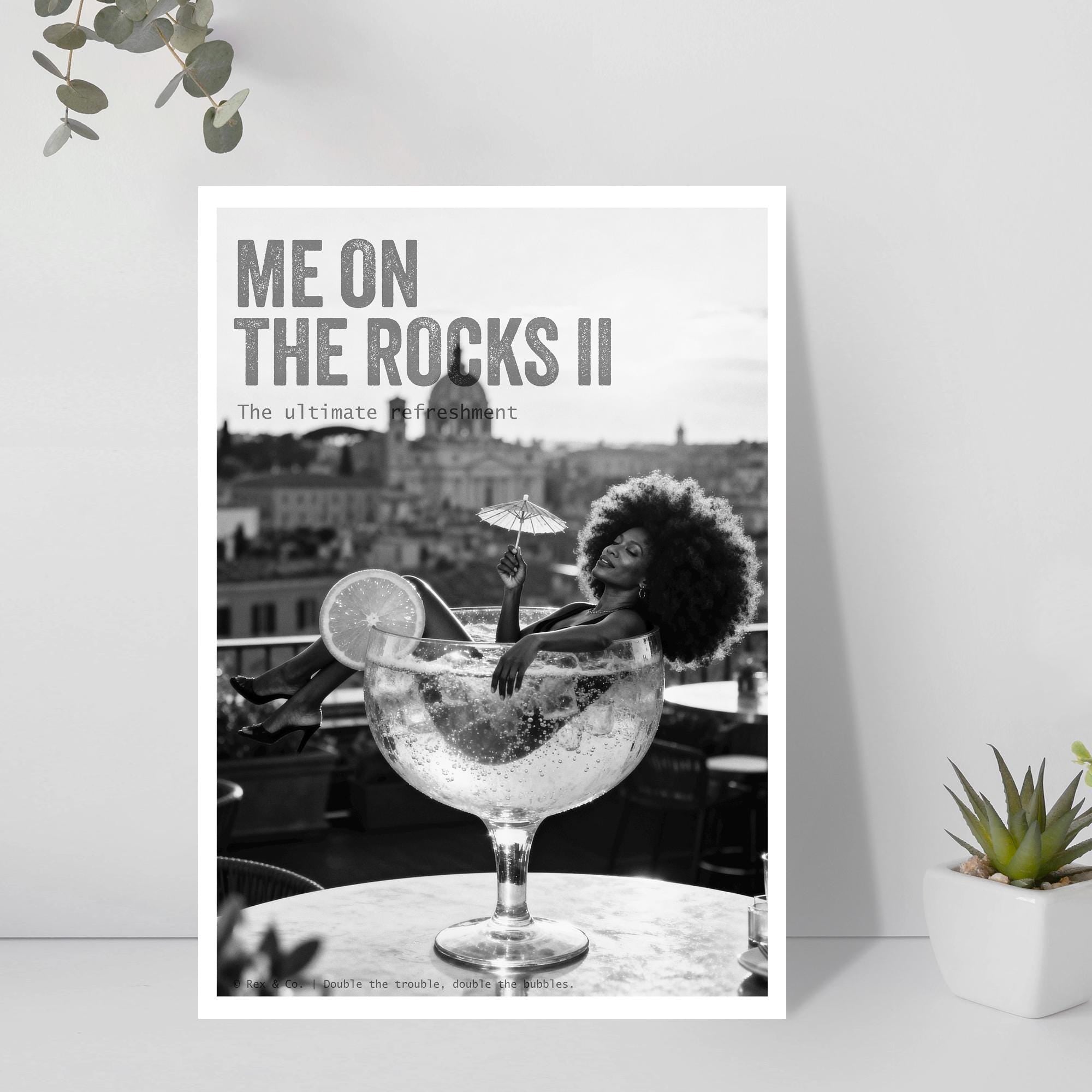 Poster with a woman in a large cocktail glass on a rooftop, text 'Me on the Rocks II' on a light gray background.