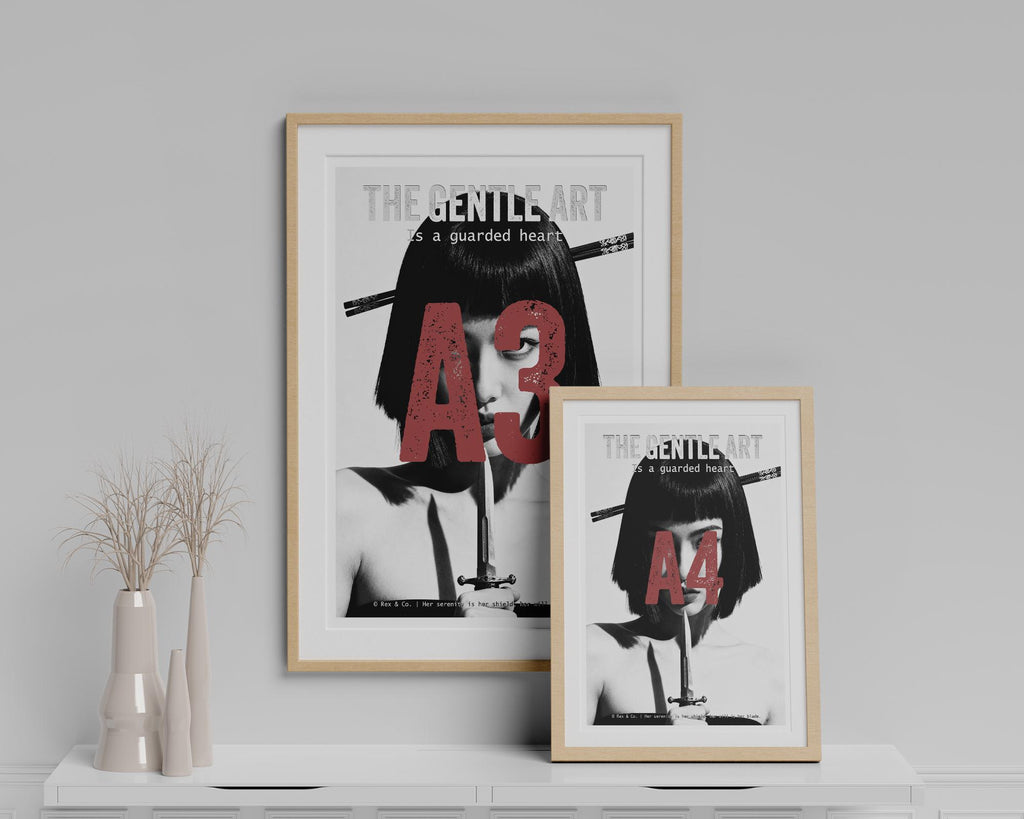 Two framed posters on a white shelf with a minimalistic background