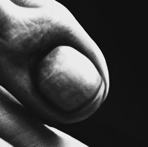 Close-up of a finger nail from the grim reaper