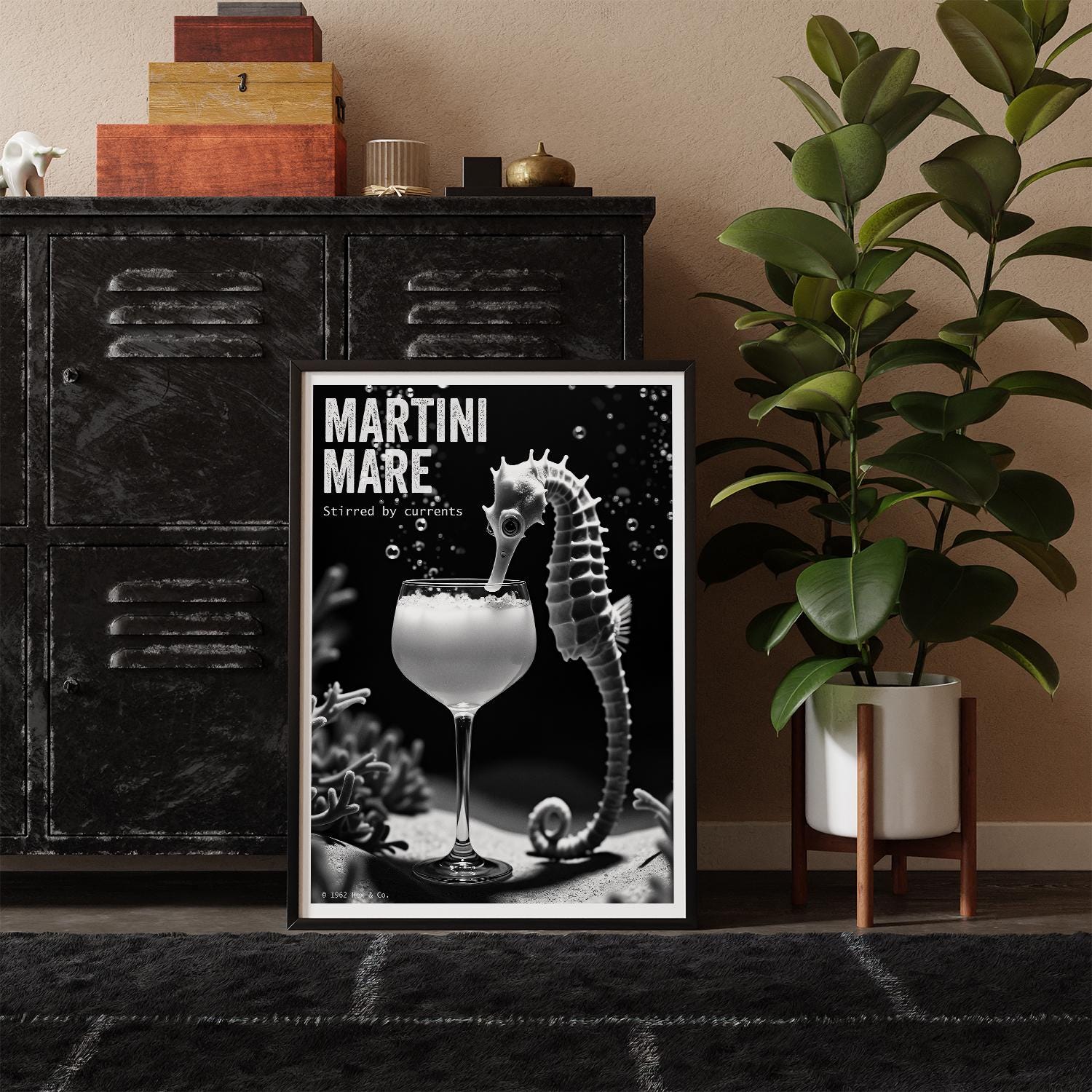 Framed poster of a cocktail with a seahorse on a shelf with decorative items and a plant.