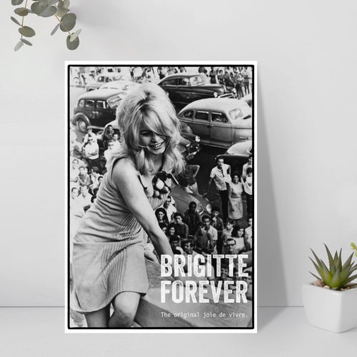 Poster of Brigitte Bardot with 'Brigitte Forever' text on a white wall with plants.