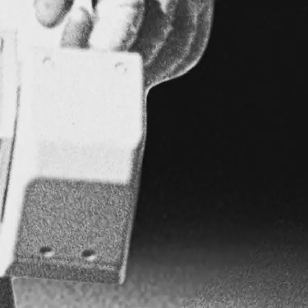 Close-up of an astronaut suit with a dark background